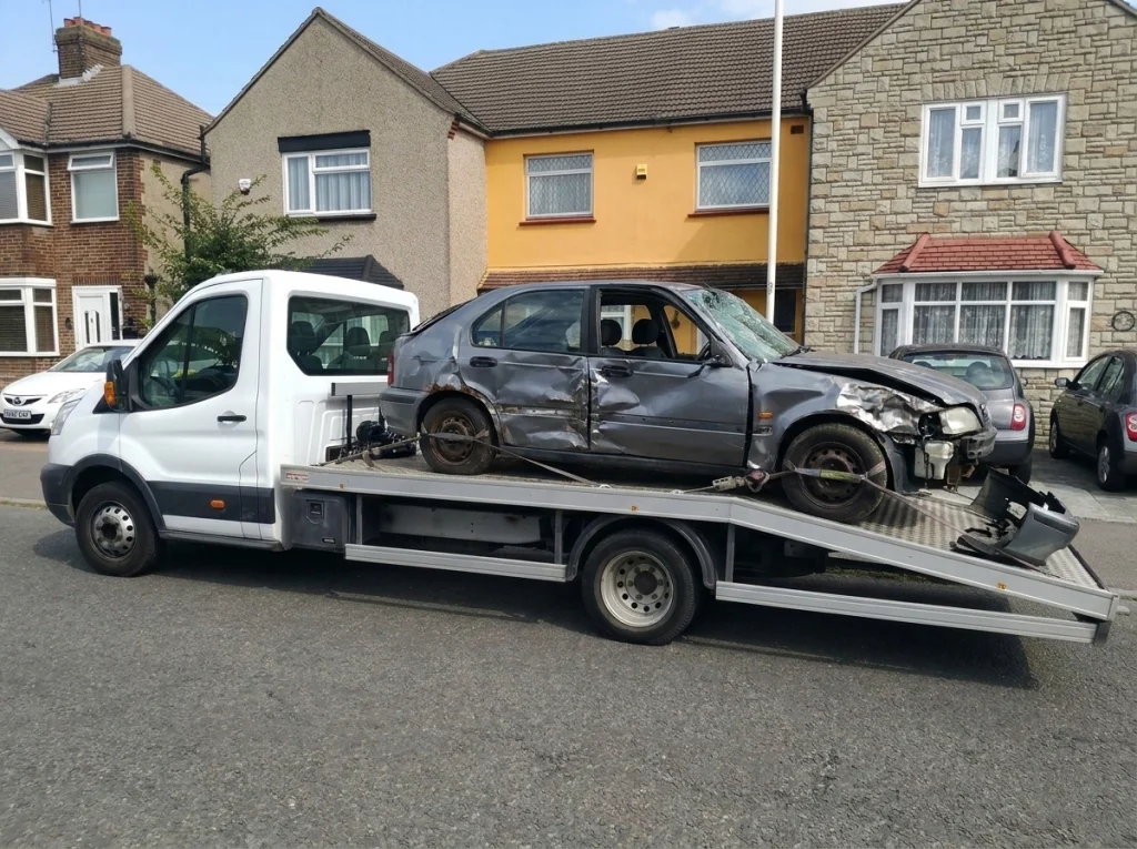 Scrap vehicle collection in Essex and London – tow truck loading damaged car